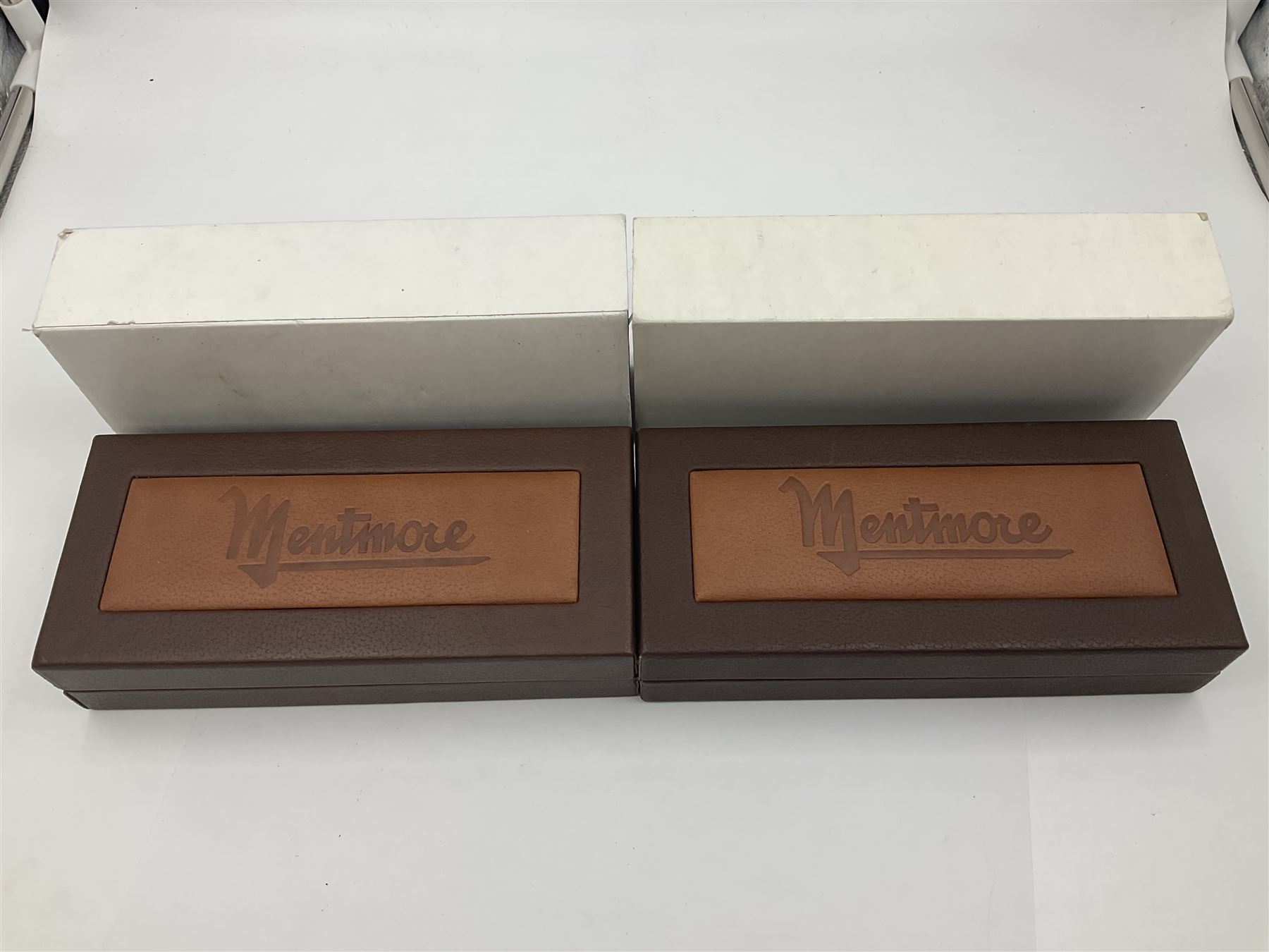 Circa 1930s Mentmore Auto Flow button fill fountain pen, the black barrel and cap with single narrow band and gold nib stamped Osmi Ridium 14ct, together with two gold nib fountain pens, each marked Huahong, the first stamped 14K 580, and second stamped 8K, both housed in Mentmore boxes (3)