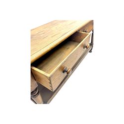 Late 19th century oak potboard dresser base, rectangular top over two frieze drawers with turned wooden handles, raised on four ring turned and tapering supports with block feet, united by a full-width lower potboard