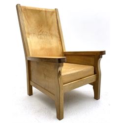 'Mouseman' oak smokers armchair, panelled sides, slung tan leather back and upholstered seat cushion, by Robert Thompson of Kilburn