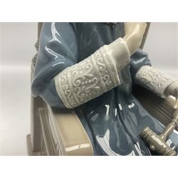 Lladro figure, Justice, modelled as a judge sat in a char, sculpted by Salvador Furió, with original box, no 5489, year issued 1988, year retired 1993, H34cm 