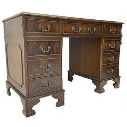 Georgian design mahogany twin pedestal desk, moulded rectangular top with leather inset, fitted with eight drawers, on bracket feet