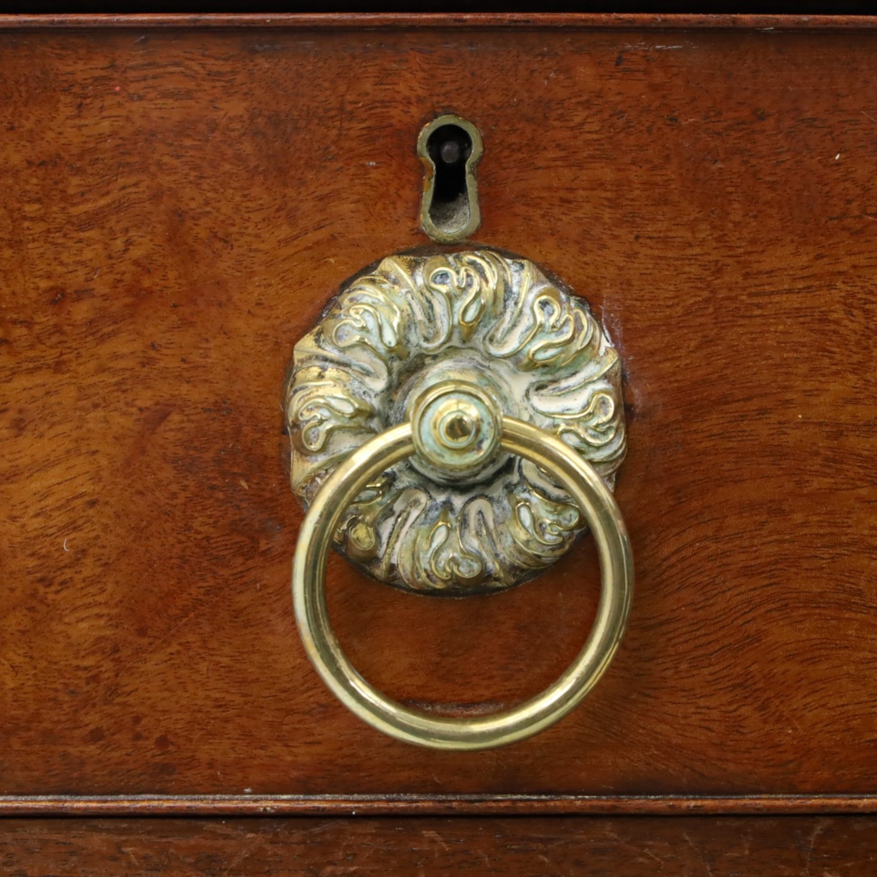 George III mahogany straight-front chest, two short over three long graduating drawers, cockbeaded edges with brass rose handles, raised on shaped supports