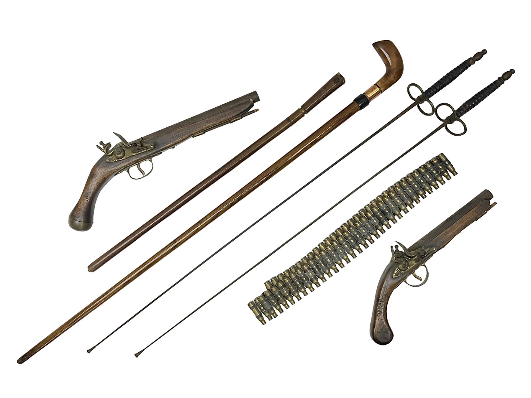 Leather covered swagger/sword stick with 40cm steel blade L62cm overall; another ash sword stick with 30cm diamond section steel blade; pair of fencing foils, the blades marked Solingen; two reproduction flintlock pistols; and 92cm inert cartridge belt (7)