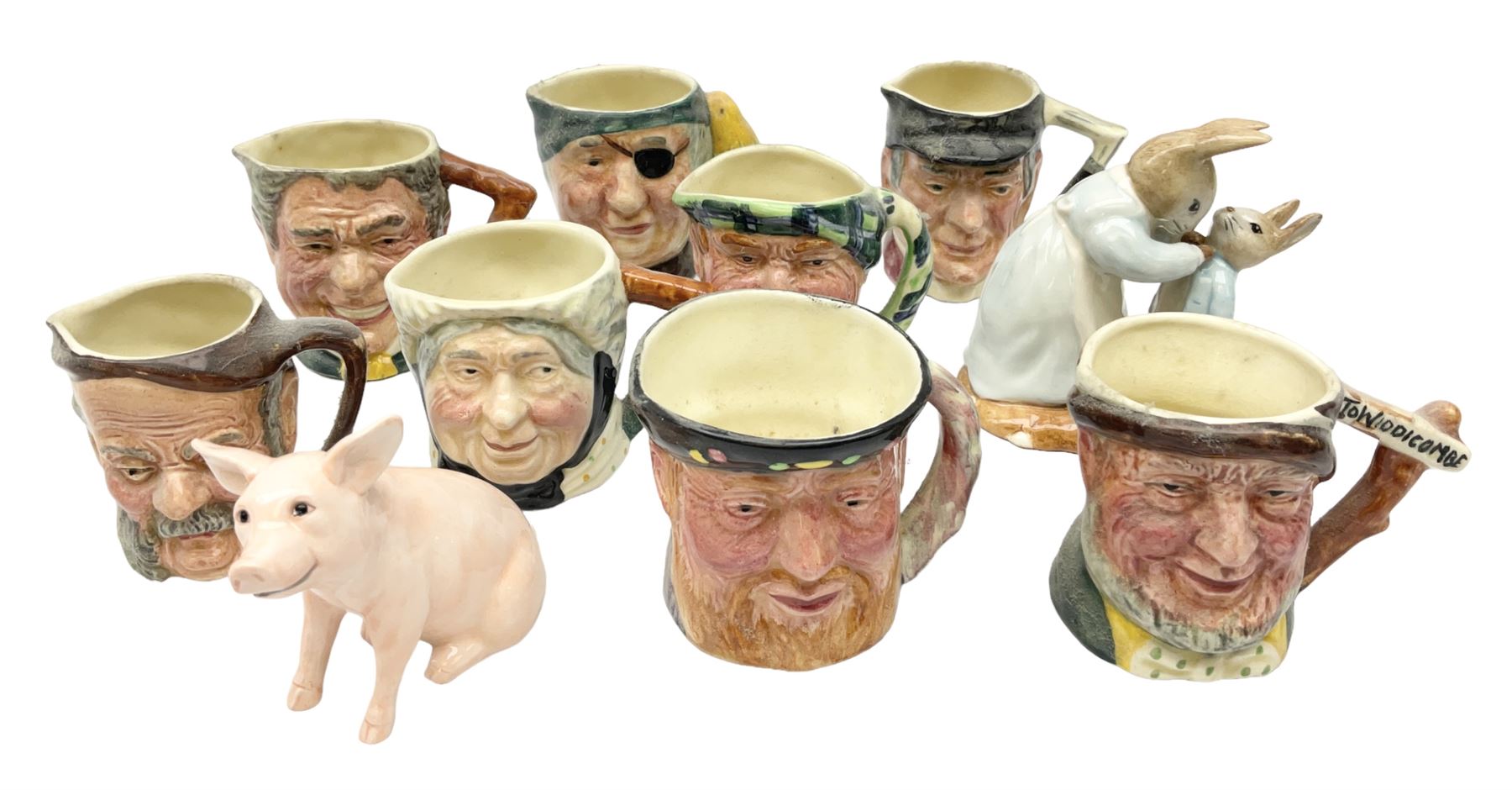 John Beswick figure of a seated piglet, Beswick Beatrix Potter Mrs Rabbit and Peter figure, and quantity of Sandland Character Ware jugs