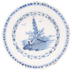 Five 18th century blue and white English and Dutch Delft plates, to include an example probably by the Abigail Griffith Delftworks in Lambeth, London, circa 1765-1775, depicting a landscape scene with house and tree, contained within geometric borders, D23cm, largest example D30cm 