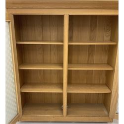 Smallbone light oak bookcase, projecting cornice above two chequered opaque glazed doors enclosing three adjustable shelves