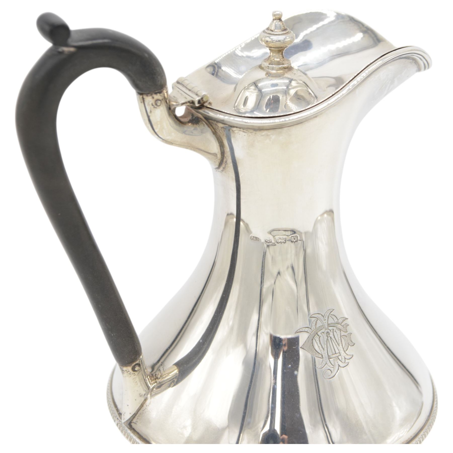 1930s silver hot water pot, of bellied form engraved with monogram to body, with Bakelite type handle and urn finial, hallmarked Fattorini & Sons Ltd, Birmingham 1938, H23cm