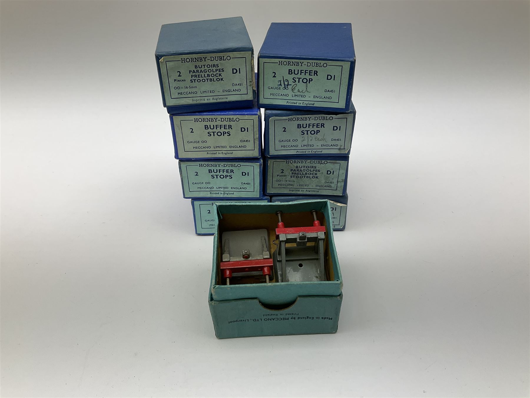 Hornby Dublo - twenty-three pairs of buffer stops including three pairs of 2451 Illuminated for two-rail track; five pairs of 3450 for three-rail track only; and fifteen D1 pairs; all boxed; and two odd loose buffers (21)
