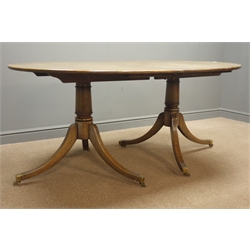  20th century medium oak twin pedestal extending dining table, turned columns on splayed supports, W107cm, H76cm, L222cm  