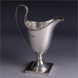 Edwardian silver helmet shaped cream jug, upon a square base, hallmarked John Rose, Birmingham 1905, together with a 1930s silver christening mug with engraved initials to body, hallmarked Aaron Lufkin Dennison, Birmingham 1936, jug including handle H13cm