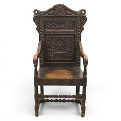 17th century style carved oak Wainscott chair, intricately carved back, united by a turned stretcher