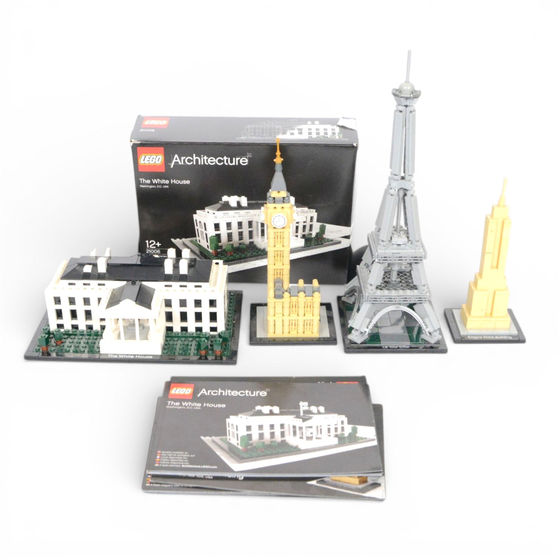 Four Lego architecture sets, comprising Empire State Building, The Eiffel Tower, Empire State Building and Big Ben, built with instructions, White House with box, tallest H33cm
