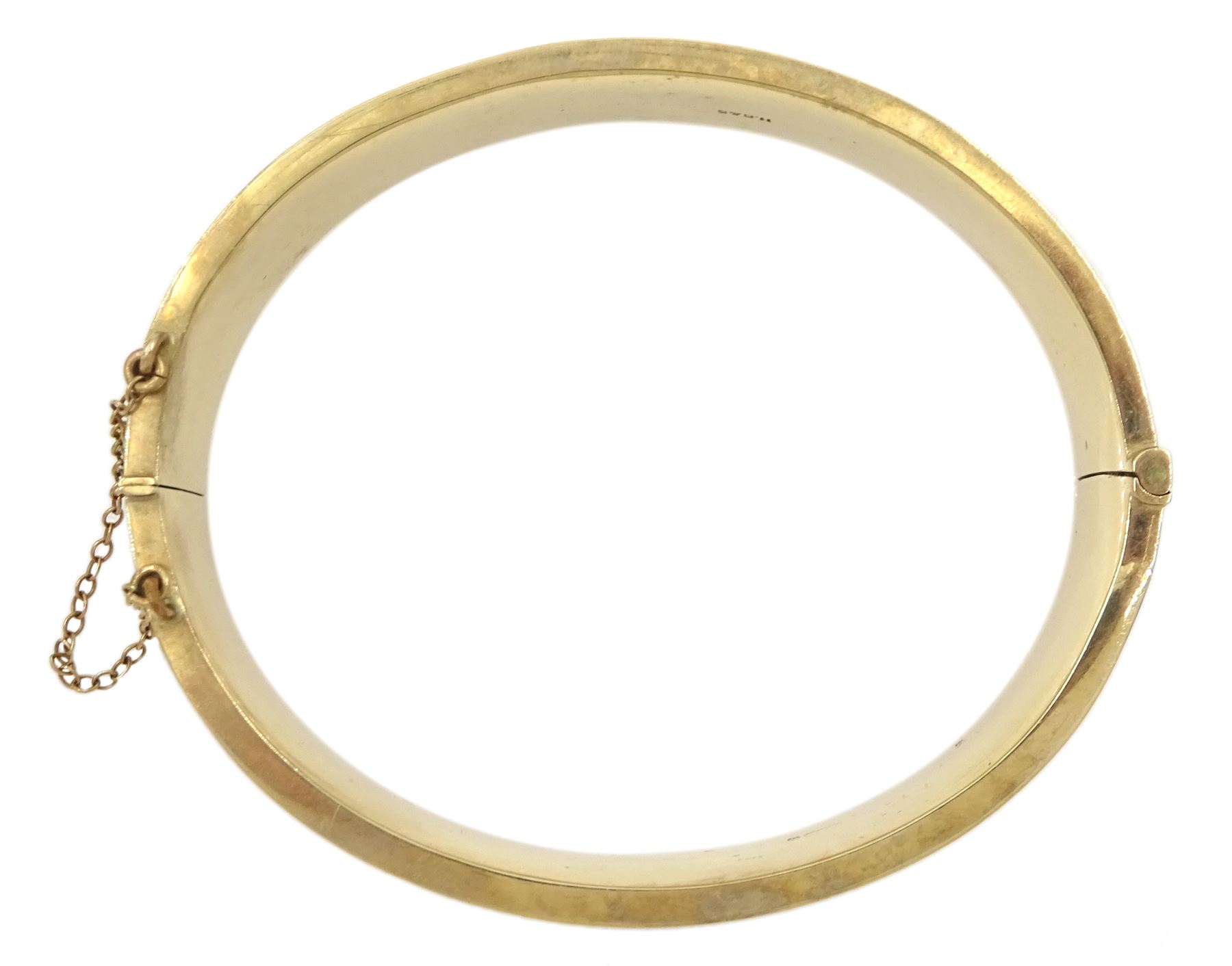 9ct gold hinged bangle with bright cut decoration by Henry Griffith & Sons Ltd, Birmingham