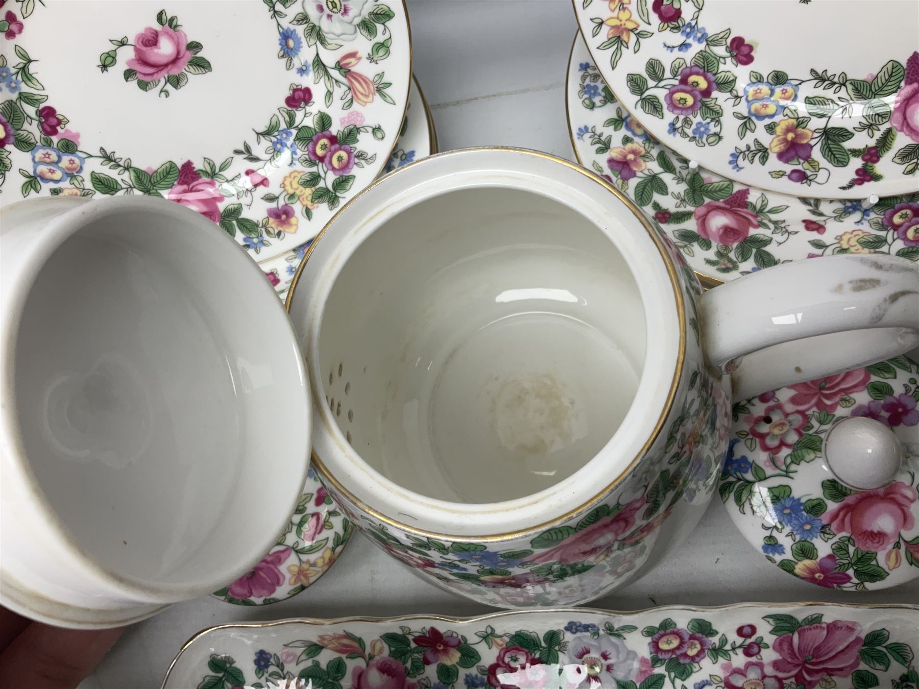 Crown Staffordshire Thousand Flowers pattern part tea service, to include teapot, two open sucriers, eighteen cups, fifteen saucers etc (57)