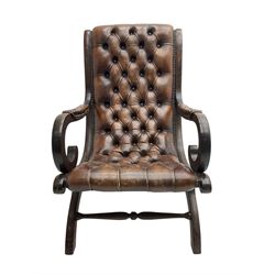 Georgian design mahogany x-framed open armchair, upholstered in studded leather