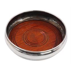 Modern silver mounted bottle coaster, of plain circular form with turned mahogany centre, hallmarked W I Broadway & Co, Birmingham 1979, D13cm