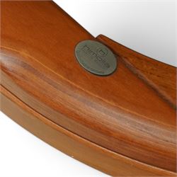 Himolla - A pair of swivel reclining chairs, beige upholstered with padded arms and high back rest, raised on a laminated circular wooden base with swivel mechanism 