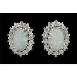 Pair of silver opal and cubic zirconia stud earrings, stamped 925 