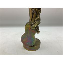 Brass figure of a nude female, standing and holding a guitar on a circular base, H38cm