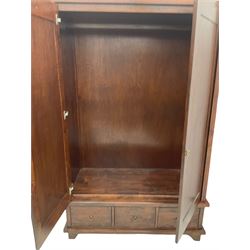 Hardwood double wardrobe, enclosed by two doors, fitted with three drawers