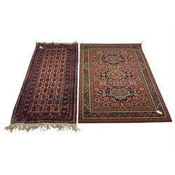Persian design wall hanging, the field decorated with three medallions (185cm x 133cm), and a Persian rug, the field decorated with repeating stylised motifs (a/f)