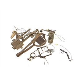 Quantity of animal traps and snares including fox trap, American 'Joe' trap, gin trap, fox and rabbit snares etc. Auctioneer's Note: These traps are sold as artefacts for ornamental purposes only as the use of some of them is illegal.