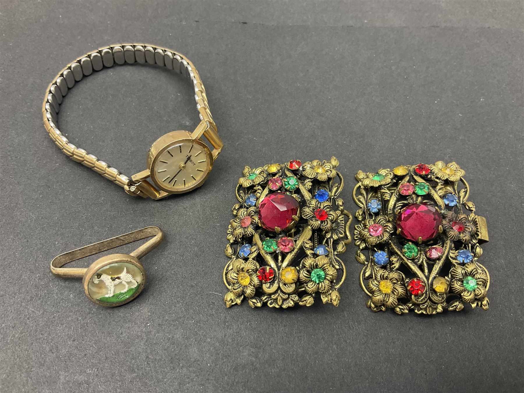 9ct gold jewellery including leaf brooch, wishbone Mizpah brooch, carnelian brooch, gold cased ladies Omega wristwatch, on leather strap and gold cased ladies Tissot wristwatch on expanding gilt strap, together with silver brooches and a Czech paste buckle, etc