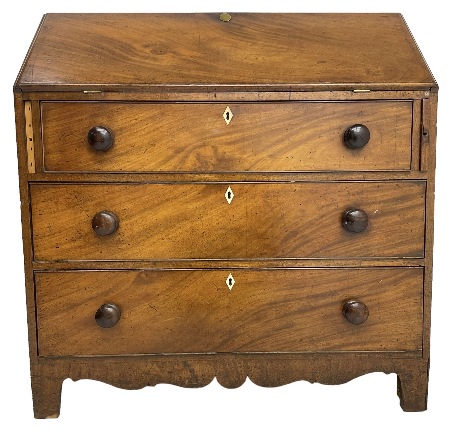 George III mahogany bureau, the fall front enclosing interior fitted with pigeon holes, drawers and cupboard, three graduating drawers below, with ivory escutcheons, shaped apron on bracket feet 

This item has been registered for sale under Section 10 of the APHA Ivory Act
