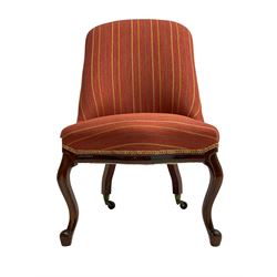 Victorian mahogany framed drawing room chair, upholstered in striped fabric with sprung seat, raised on cabriole supports