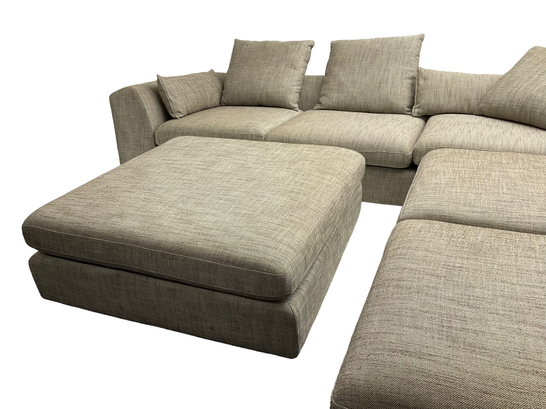 Contemporary corner sofa upholstered in grey fabric (310cm x 282cm); with matching rectangular footstool (110cm x 110cm)