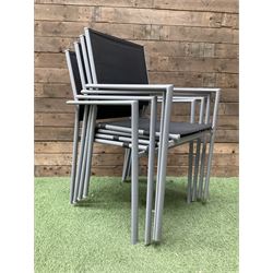 Rectangular metal framed garden table with glass top and four stackable chairs - THIS LOT IS TO BE COLLECTED BY APPOINTMENT FROM DUGGLEBY STORAGE, GREAT HILL, EASTFIELD, SCARBOROUGH, YO11 3TX