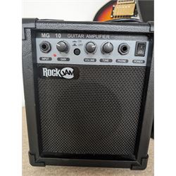 Rock Jam six string electric guitar, together with a Rock Jam amplifier and an Atrics guitar