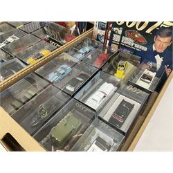 Fabbri James Bond Collection - over one hundred and ten die-cast models in perspex display cases as issued periodically; and a quantity of associated magazines and trading cards, in five boxes