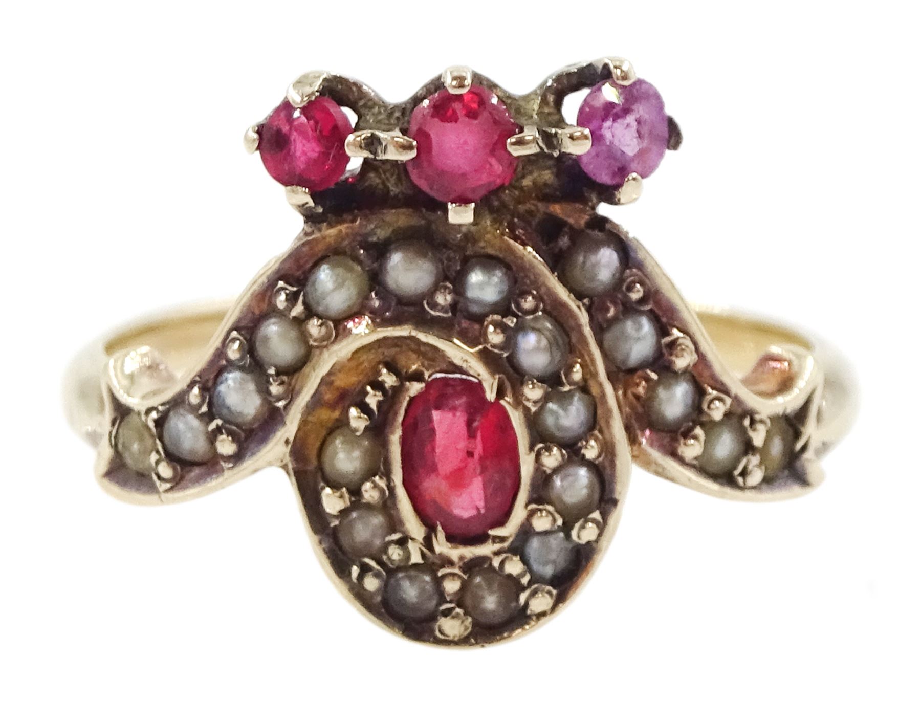 Victorian 9ct rose gold red paste and seed pearl ring, oval paste stone within a scrolling border of seed pearls, surmounted with round cut red paste stones