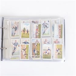 Collection of Edwardian and later Football related trading and cigarette cards, including forty-nine of fifty 1906 Ogden's Football Club Colours, 1922 PALS Footall series, ninety of one hundred 1925 Gallaher Famous Footballers, complete set of forty-four 1926 Ogden's Captains of Association Football Clubs and Colours, complete set of fifty 1927 Players Football Caricatures by MAC,  complete set of fifty 1927 Players Football Caricatures by RIP,  complete set of fifty 1930 Players Association Cup Winners, complete set of 50 1933 Ogdens AFC Nicknames etc, housed in brown cigarette card album