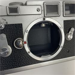 Leica M3 camera body, 1959, chrome finish, serial number '986937', fitted with 'Ernst Leitz GmbH Wetzlar Summicron f=5cm 1:2 Nr.1592614' lens, with Leica M3 instruction booklet
