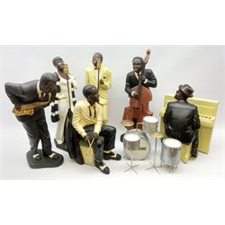 A group of six large composite Jazz Band figures comprising Pianist, double Bass player, male and female singers, drummer and Saxophone Player, tallest H58cm