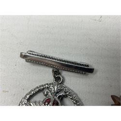 WW2 group of four medals comprising 1939-1945 War Medal, Defence Medal, Italy Star and 1939-1945 Star; with Royal Army Service Corps cap badge and RASC chrome and enamel sweetheart brooch