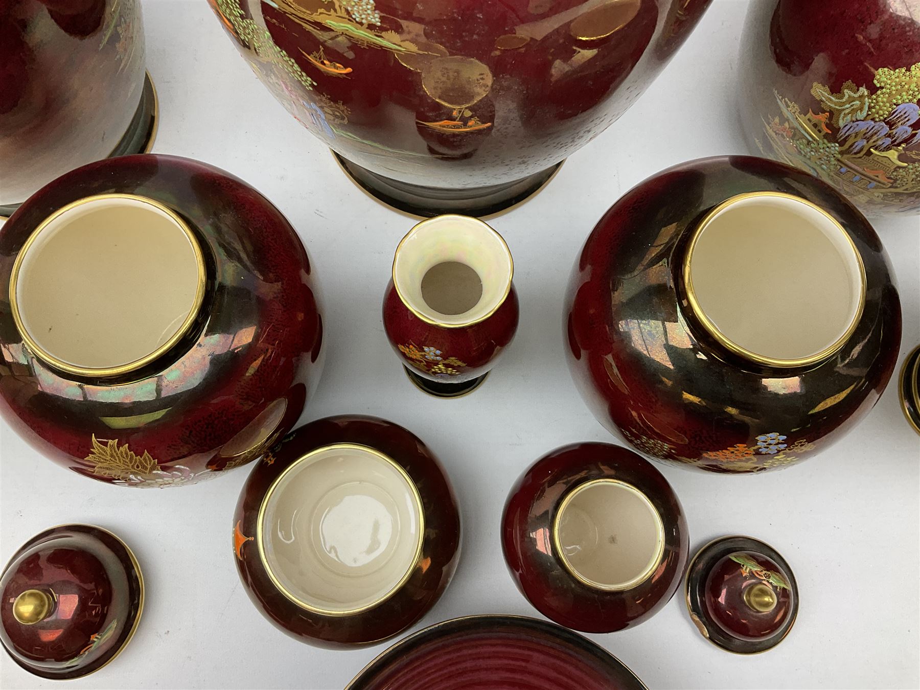 Two Crown Devon Rouge Royale pattern large temple jars with temple dog finial to lid, together with seven other Crown Devon ceramics and two lidded Carlton Ware temple jars in Red Royale, tallest example H47cm (11)