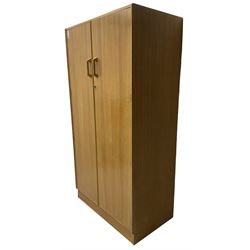 E. Gomme for G-Plan - 'Brandon' light oak double wardrobe, the interior fitted with hanging rail and shelves 