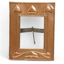Newlyn type Arts and Crafts copper photograph frame decorated with a fish and galleon 24cm x 20cm with oval aperture and two other Newlyn style beaten copper frames (3)