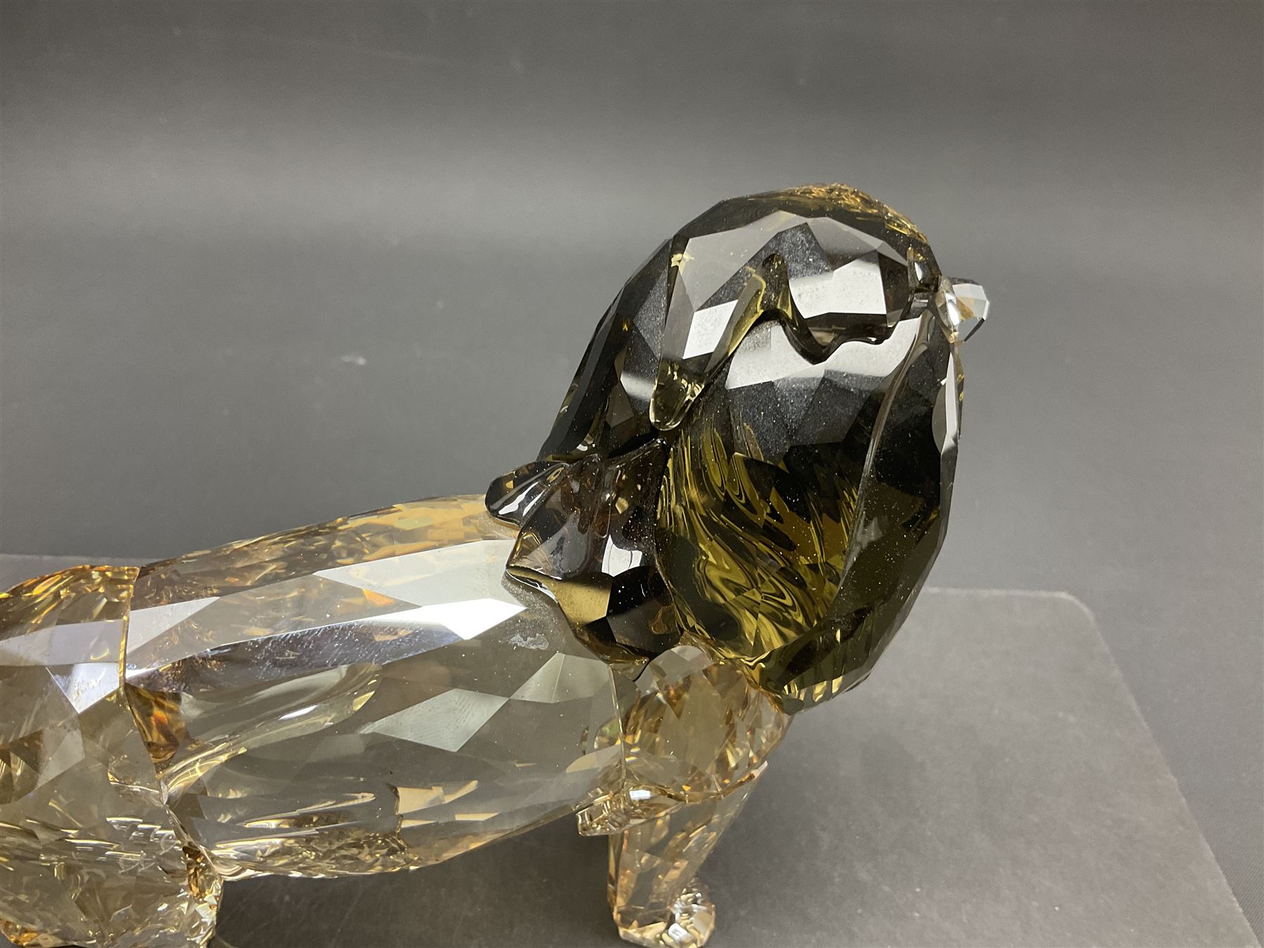 Swarovski Crystal lion, Akili, together with small Swarovski Crystal plaque with lion silhouette, H13cm