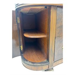 Late 20th century Italian walnut sideboard, serpentine front and bow-shaped top with highly figured veneer, single checkered-pattern frieze drawer over two drawers with central foliage cartouche, flanked by hinged frieze drawers over cupboards, on turned and carved supports