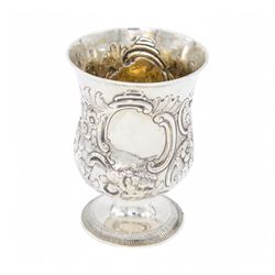 George III silver cup of circular form, embossed with scrolling and floral decoration, upo...