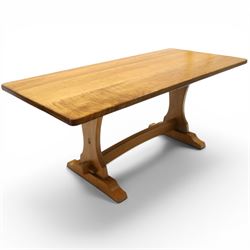 Knightman - oak refectory dining table, the rectangular adzed top raised on shaped trestle...