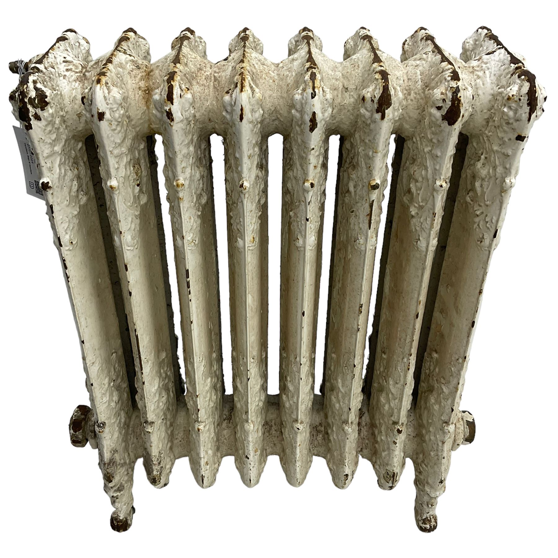 Victorian white painted cast iron radiator, decorated with trailing leafy branches and flowerheads