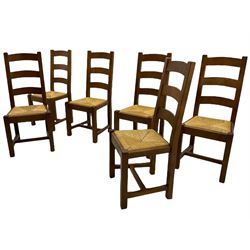 Antix French oak dining table with two leaves, two frieze drawers;, and six ladder back chairs with rush seats