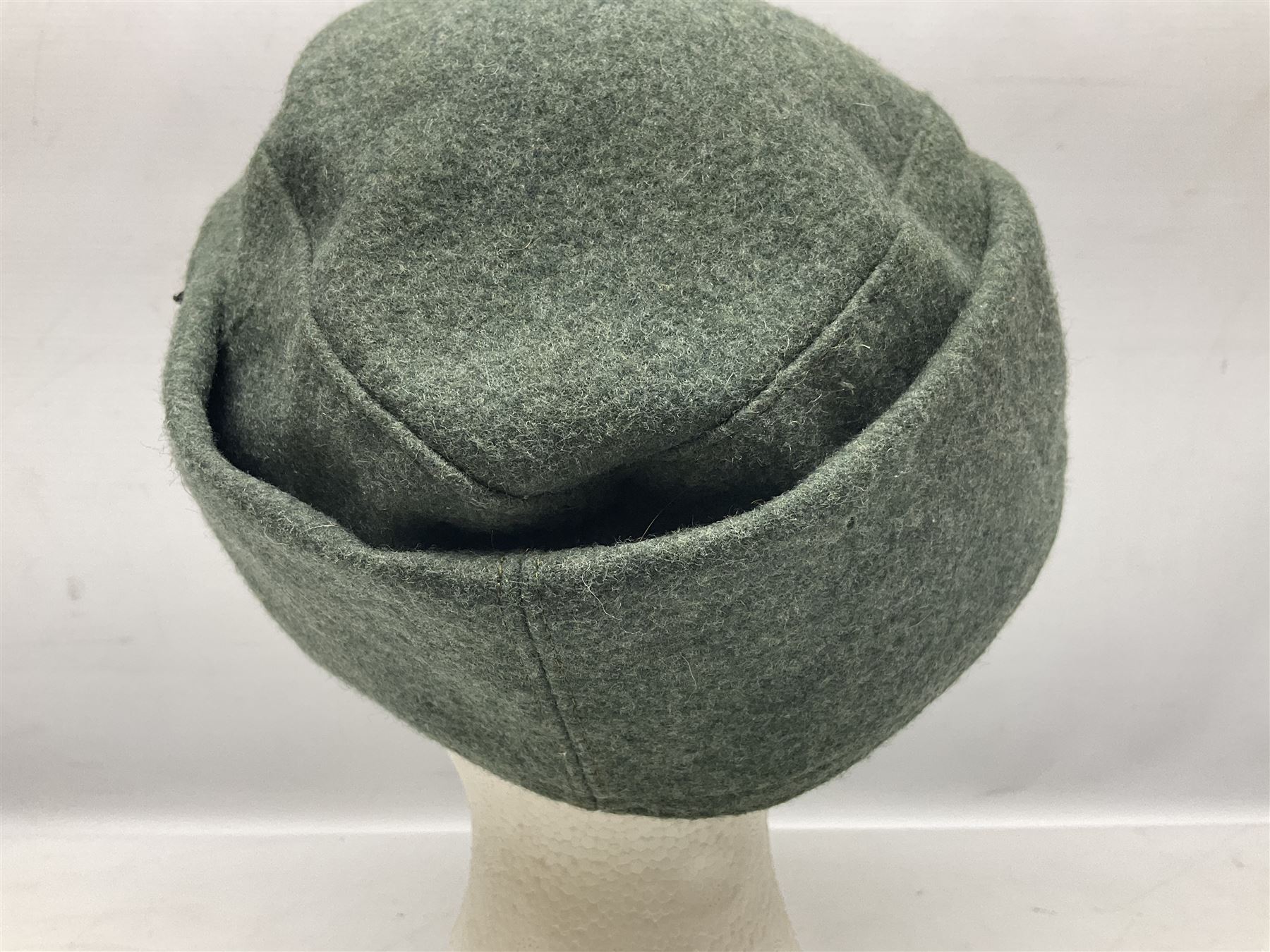 WW2 German Army M43 field cap with triangular cloth eagle and roundel badge and metal edelweiss badge for mountain troops; faintly stamped '5 VMF(?)'