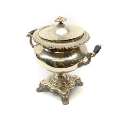 A 19th century silver plated hot water urn and cover, the twin handles with ebonised insulators, the body with foliate detail, and raised upon a base supported by four scroll feet, the cover marked beneath Parkinson's 70 Oxford St London, H40cm. 