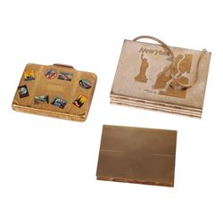 Six powder compacts, including Kigu Bon Voyage example modelled as a suitcase with travel stickers, Volupte compact, three Mascot compacts, including musical handbag and a New York Vanity
